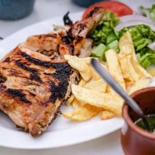 Half chicken with chips and salad
